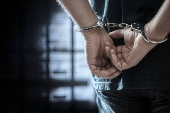 A close-up of a person's hands in handcuffs against a dark background, highlighting a situation requiring immediate legal representation from an experienced Felony DUI Defense Attorney.