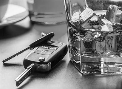 Car keys and a drink representing the owi lookback period michigan uses