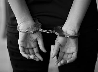 Handcuffs representing felony OWI third offense charges